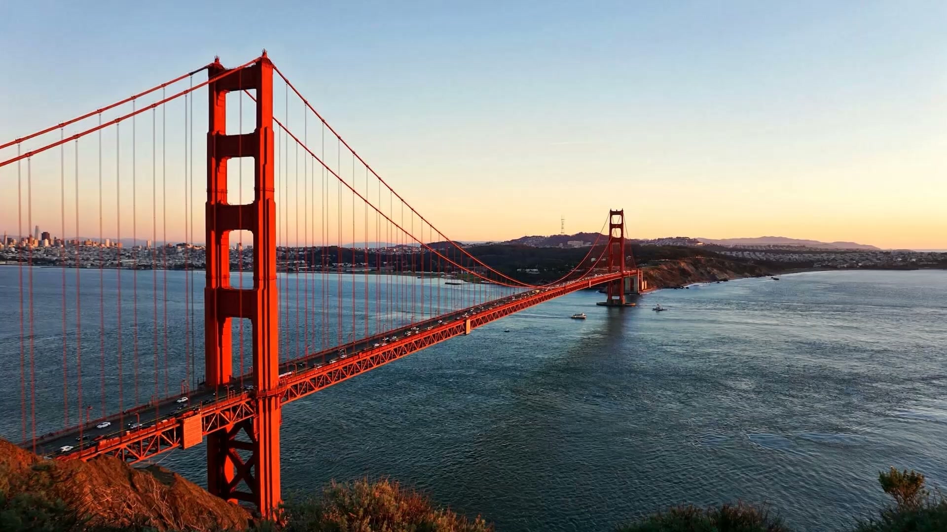 The Golden Gate Bridge spanning San Francisco Bay at sunset